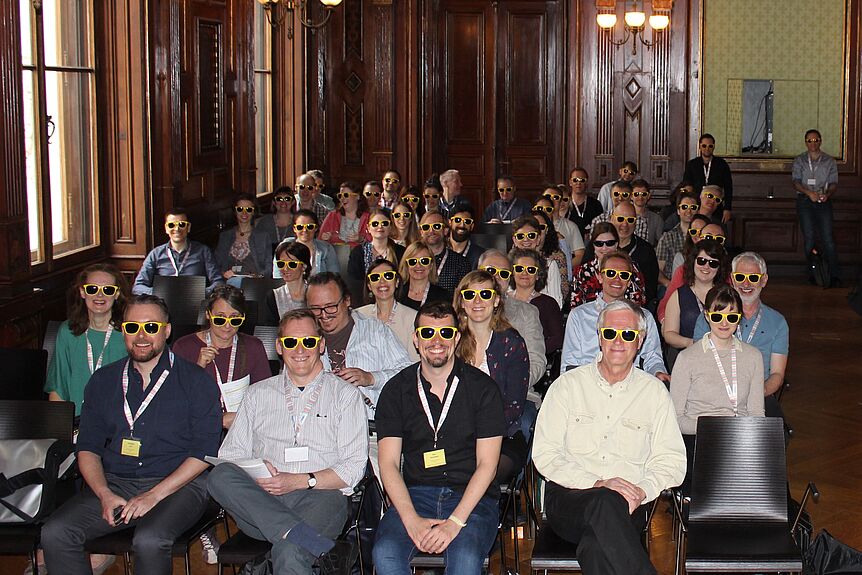 Syposium participants wearing yellow "sulfur goggles".